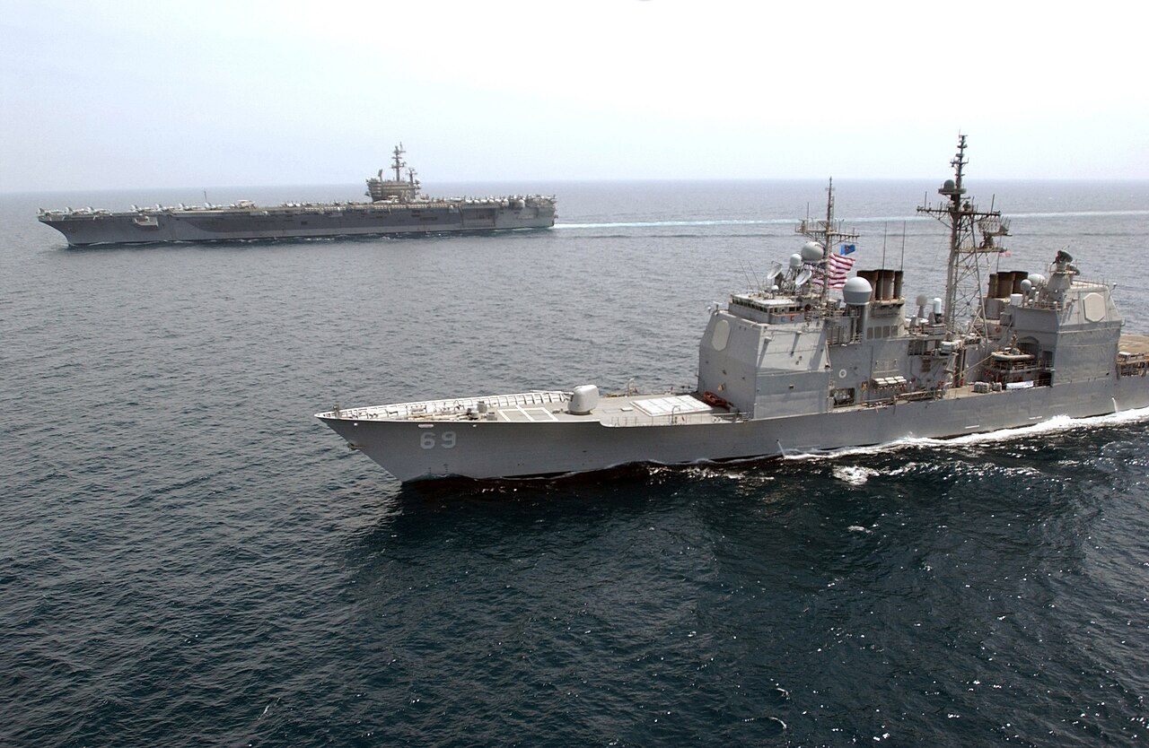 The aircraft carrier USS Ronald Reagan and guided-missile cruiser USS Vicksburg in the Persian Gulf.