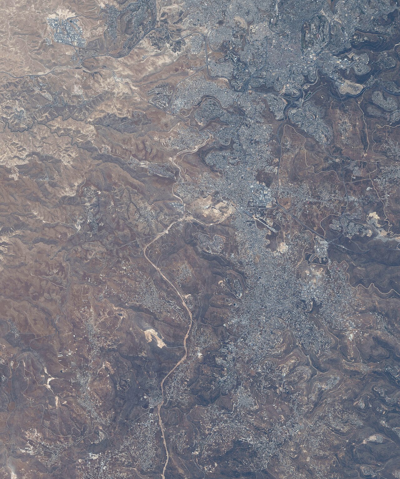 Modified ISS imagery showing the West Bank including Ramallah and surrounding villages and settlements.