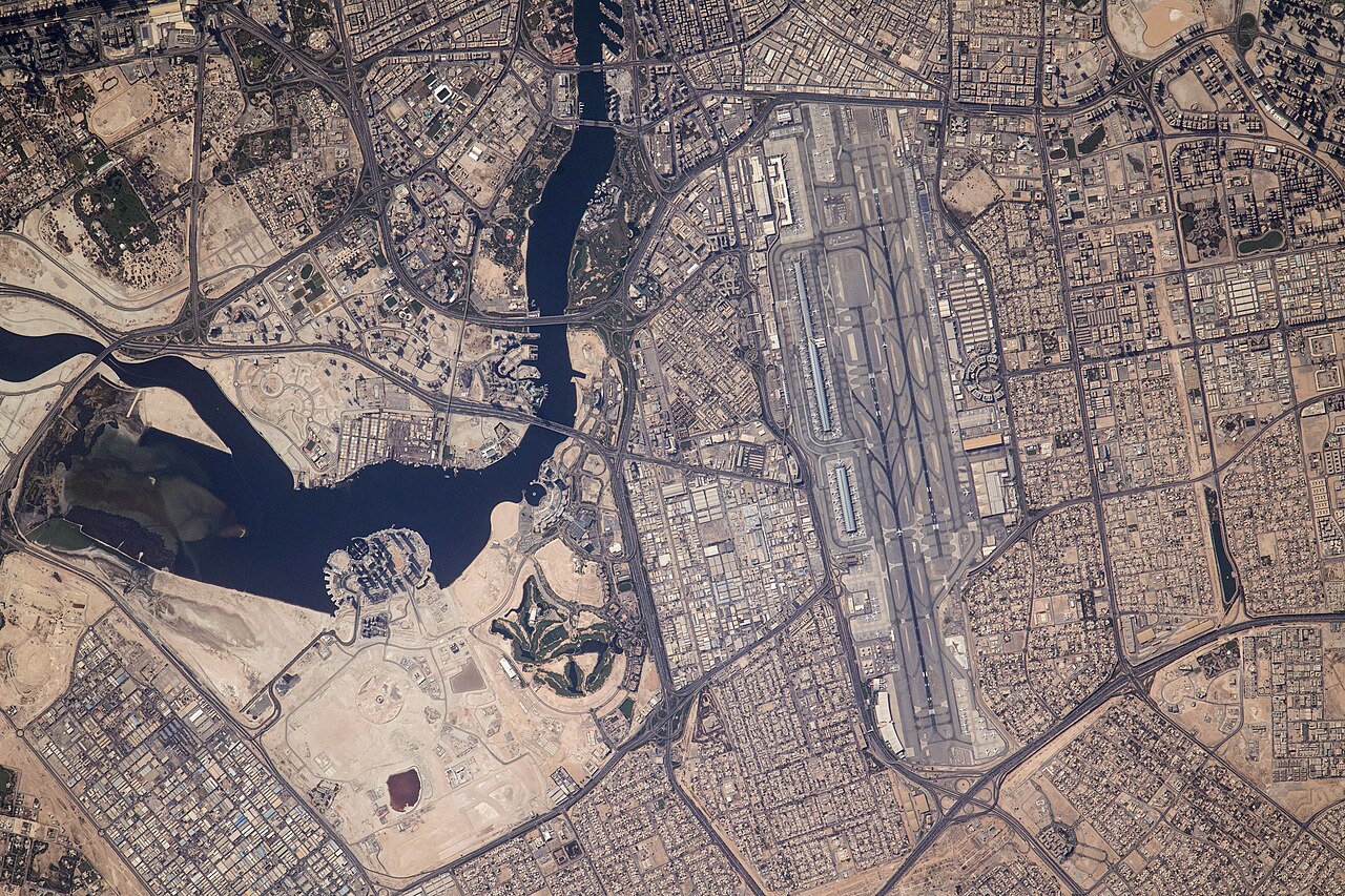 Modified NASA imagery showing Dubai International Airport and Dubai Creek from the International Space Station.