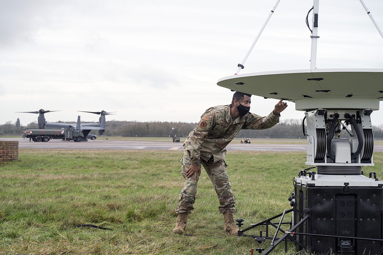 A 352nd Special Operations Support Squadron communications Airman checks satellite link connections at RAF Fairford.