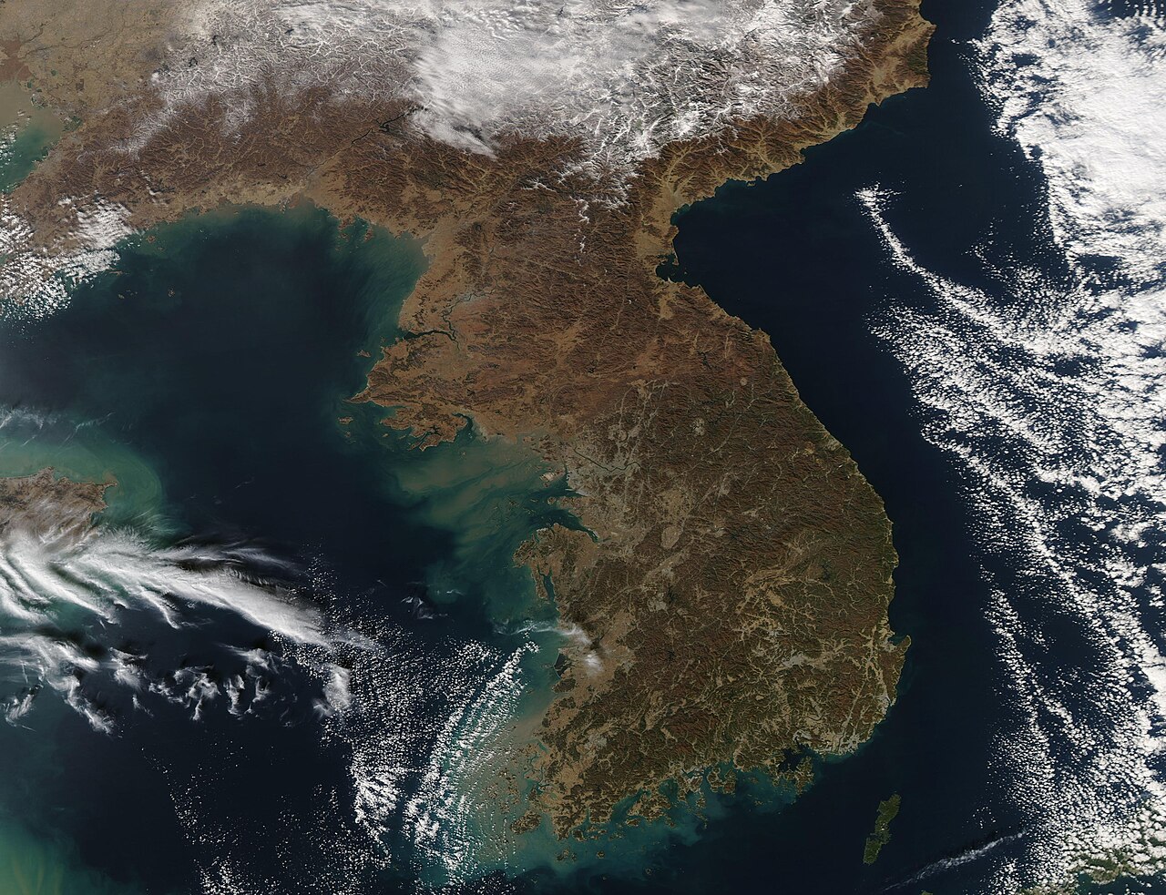 Modified NASA MODIS satellite data showing the Korean Peninsula with the border.