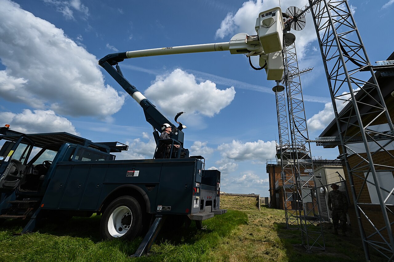 Airmen service an antenna on the flightline at RAF Fairford.