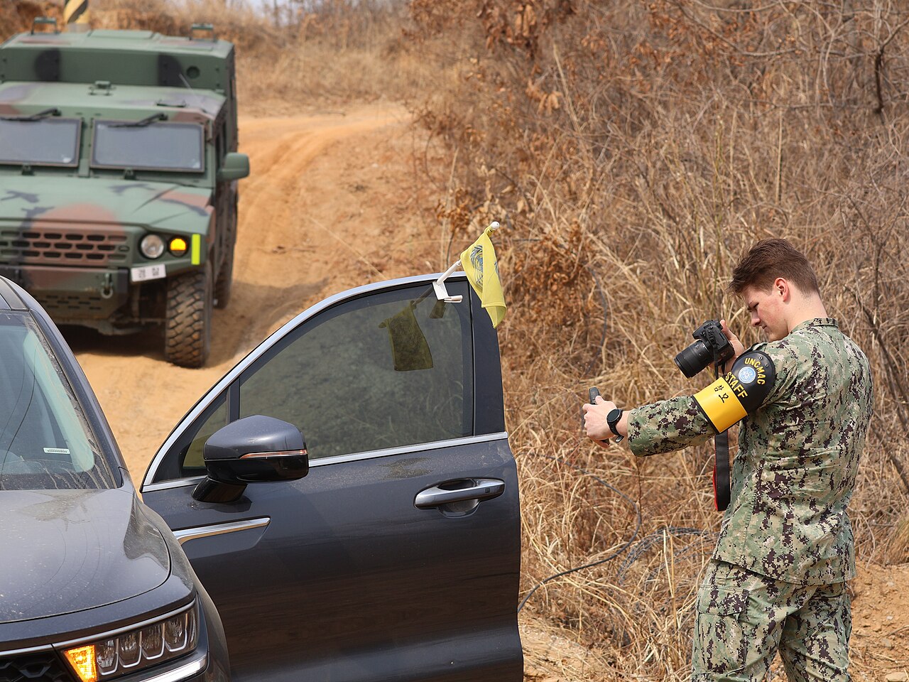 A UN Command staff member uses a GPS device to confirm a location near the DMZ.