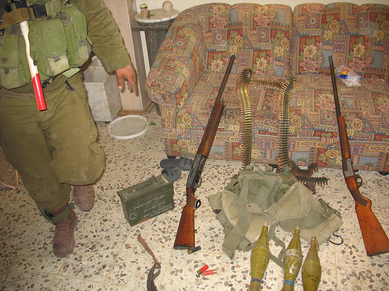 Israeli military display a weapons cache found during operations in the village of Itron in Lebanon.