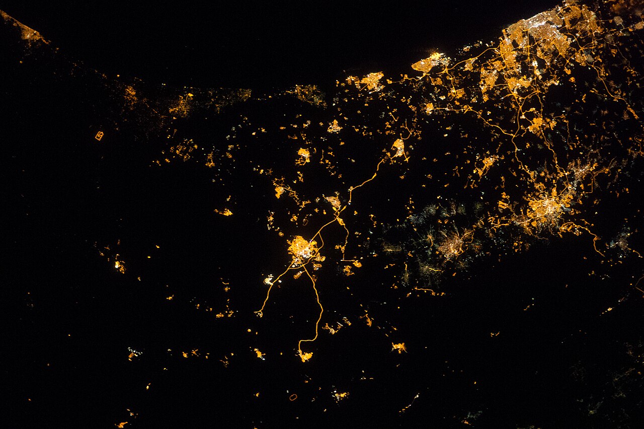 ISS photograph showing Israel and Gaza at night with explosions and rocket fire visible from orbit.