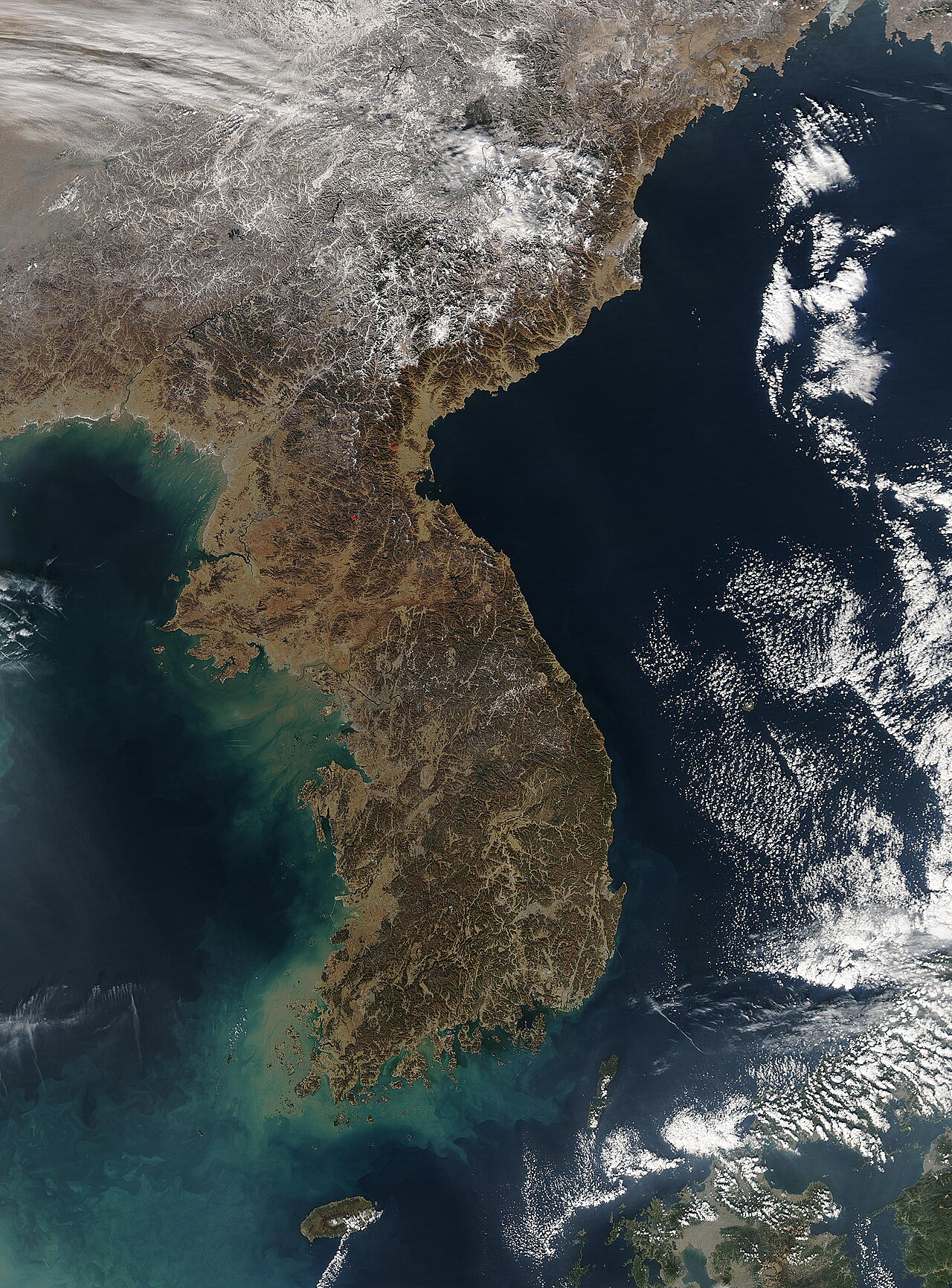 The Korean Peninsula with mountainous terrain visible.
