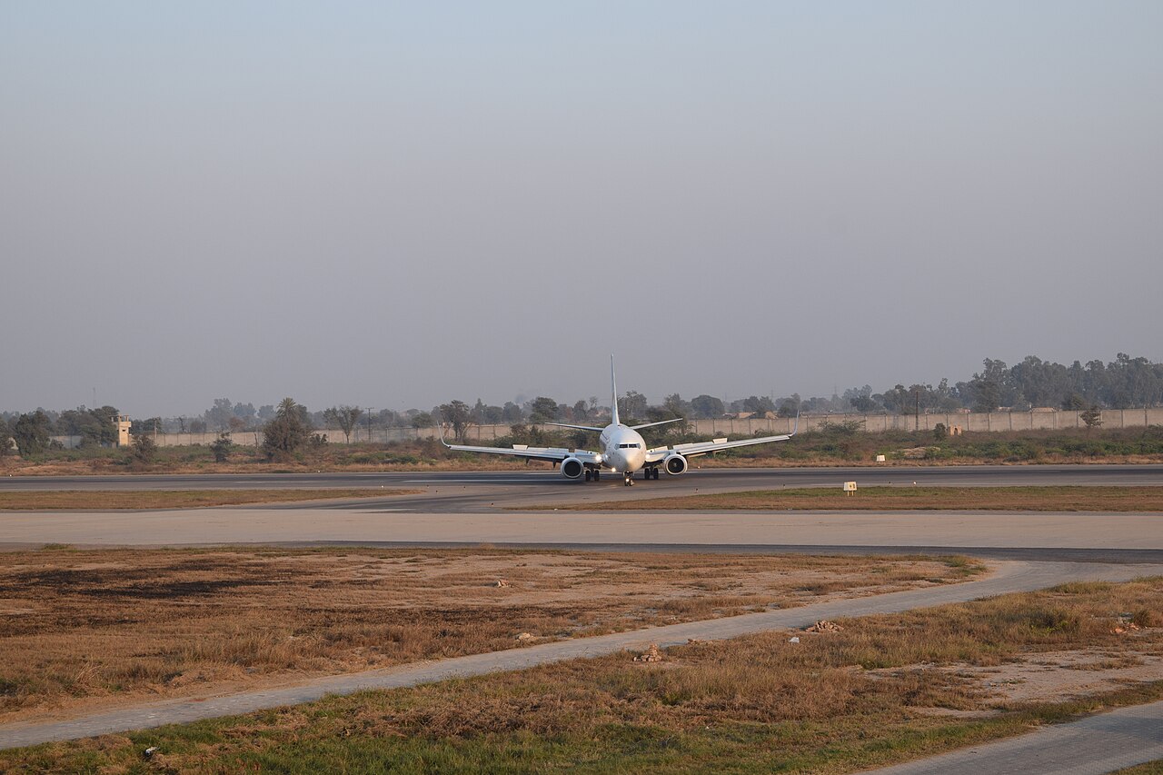 A FlyDubai Boeing 737 turning off the active at Faisalabad International Airport, Punjab, Pakistan