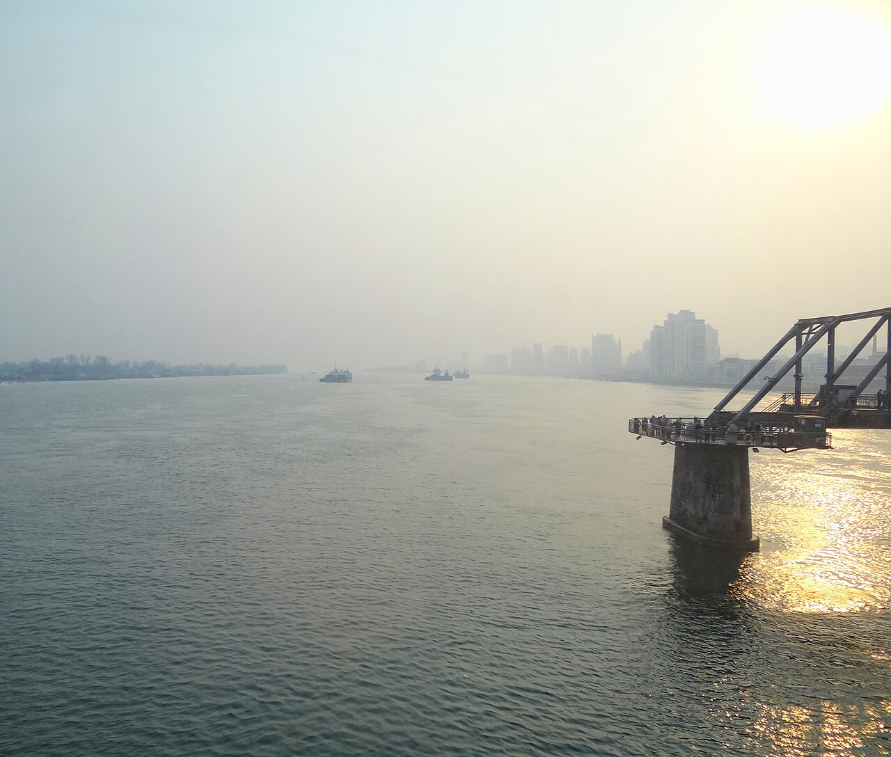 The Yalu River border between China on the right and North Korea on the left, seen from a train.