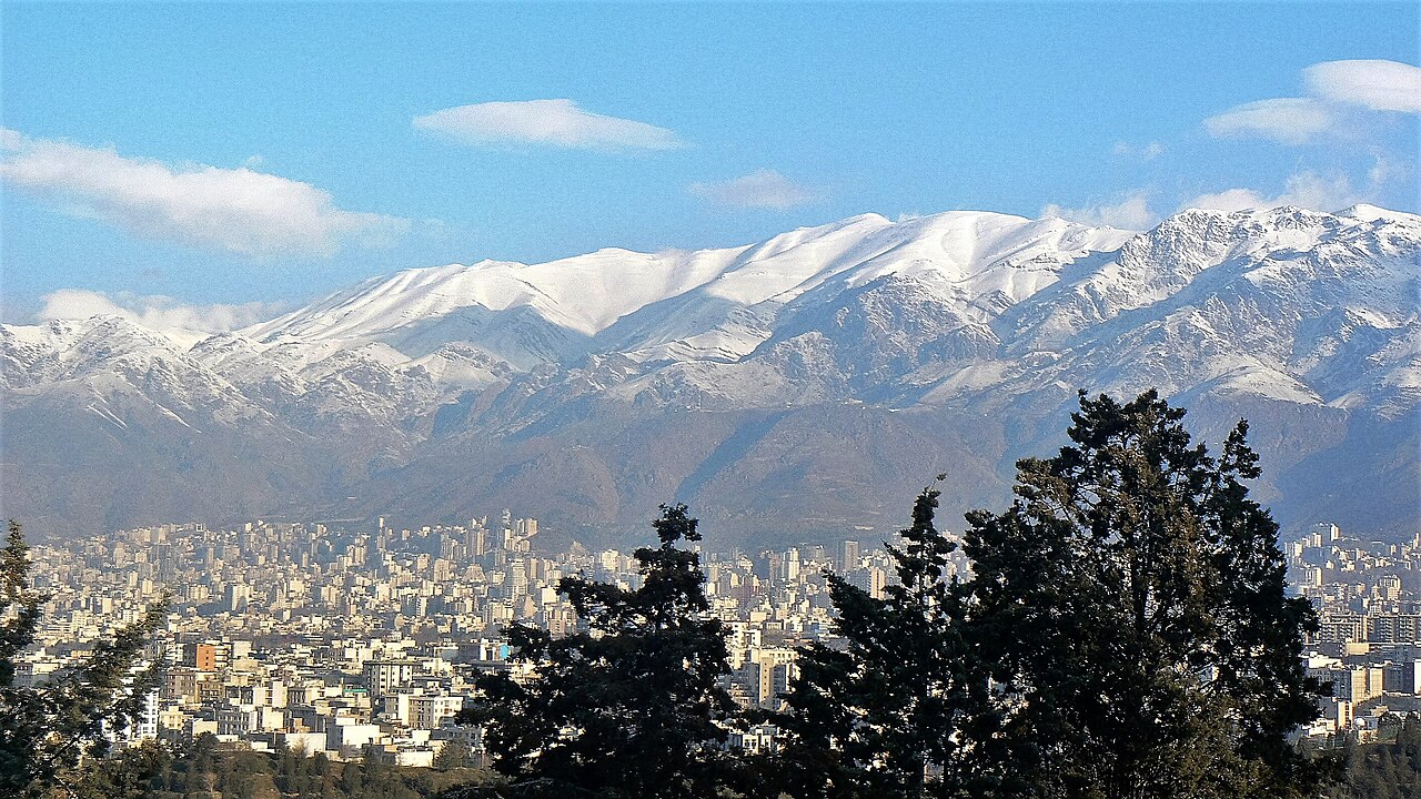 Tehran in winter with snow-covered Toochal mount
