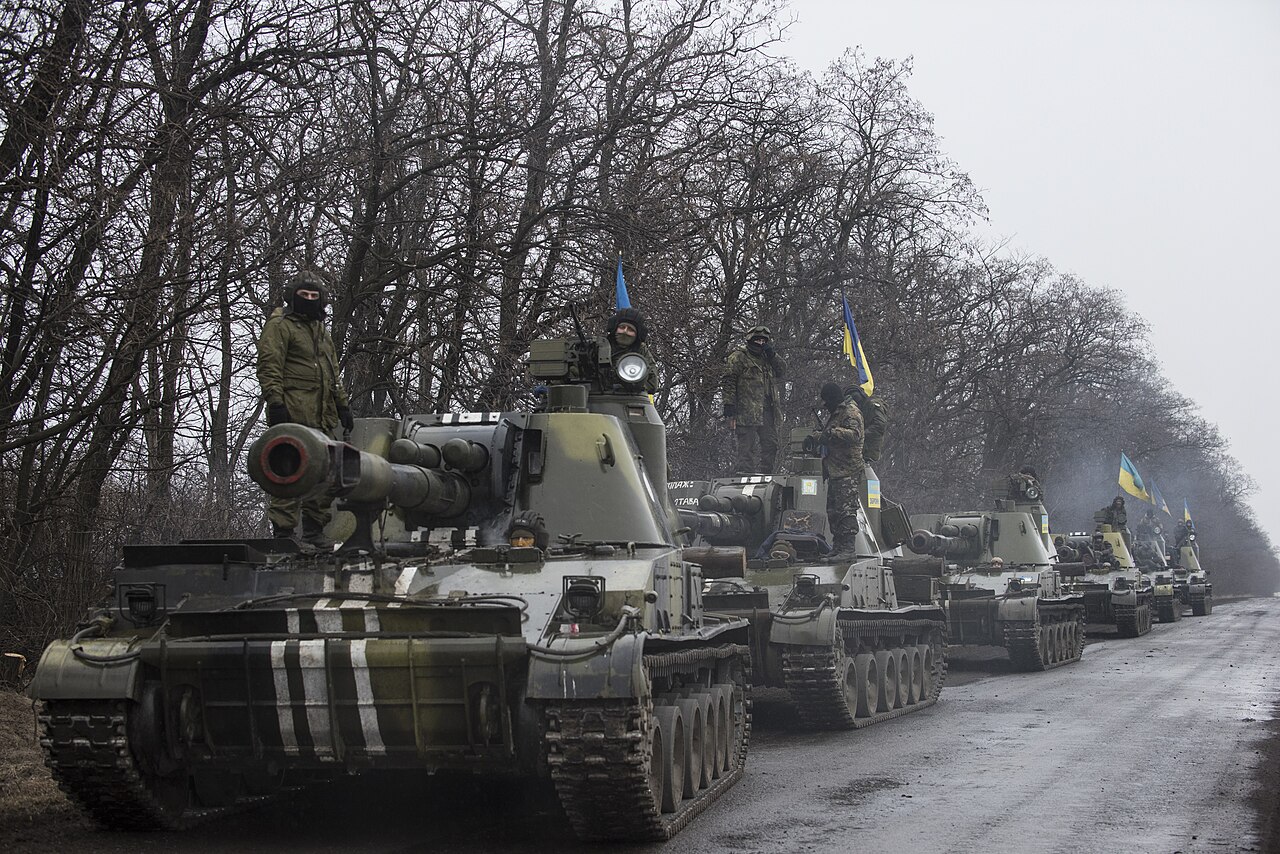 Six 2S3 Akatsiya 152-mm howitzers with crews and Ukrainian flags, March 2015.