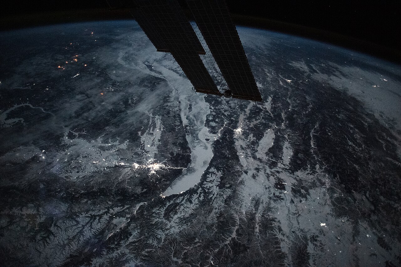 Contains modified ISS photograph showing Lake Baikal and surrounding Siberia at night in January 2024.
